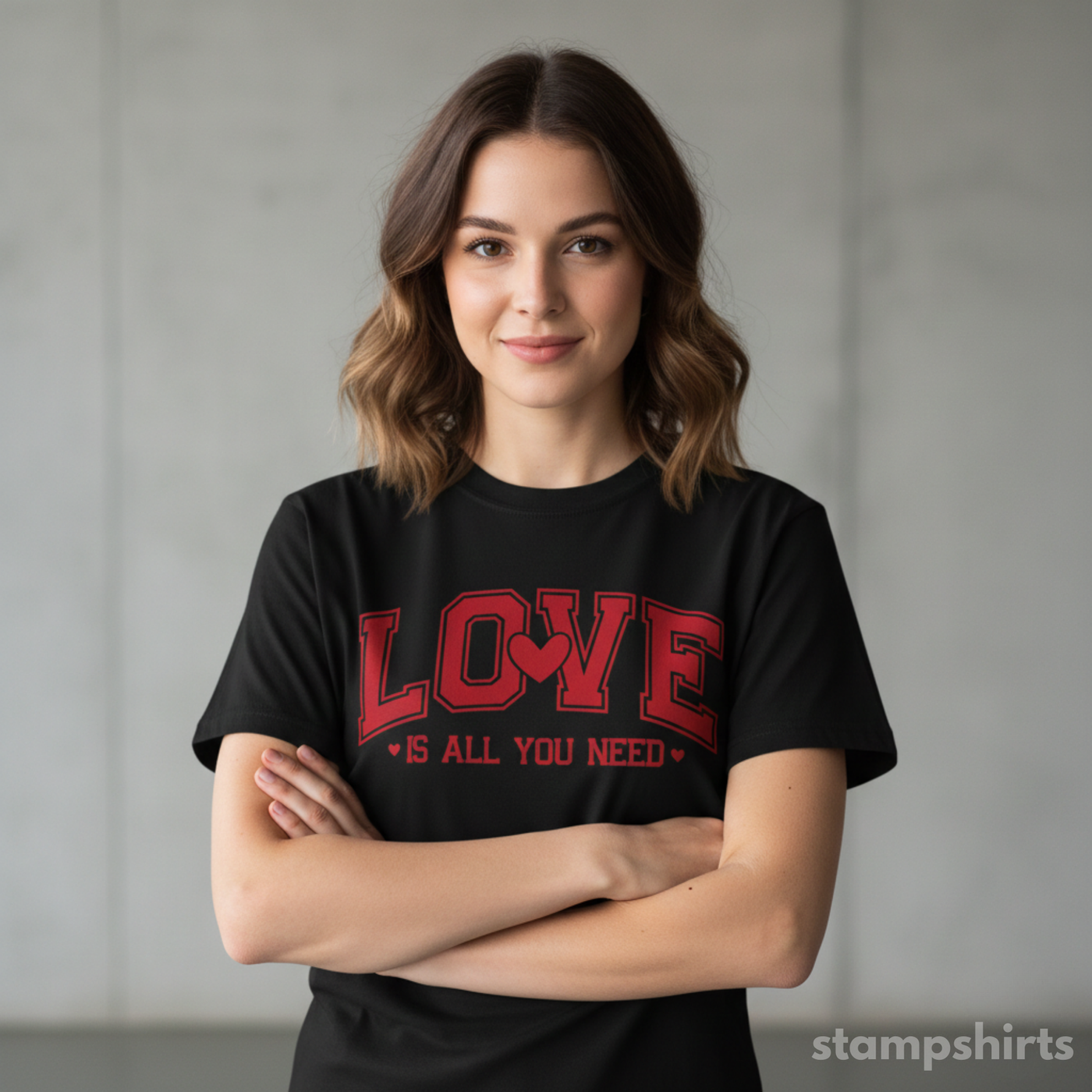 Woman wearing a black t-shirt with red text 'LOVE is all you need' against a plain background image 2