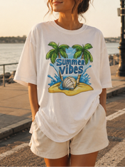 Woman wearing a 'Summer Vibes' t-shirt by the waterfront