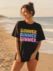 Woman wearing a black t-shirt with 'SUMMER SUMMER SUMMER' in colorful letters on a beach.