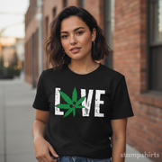 Woman wearing a black t-shirt with a cannabis leaf design and the word 'LOVE'.