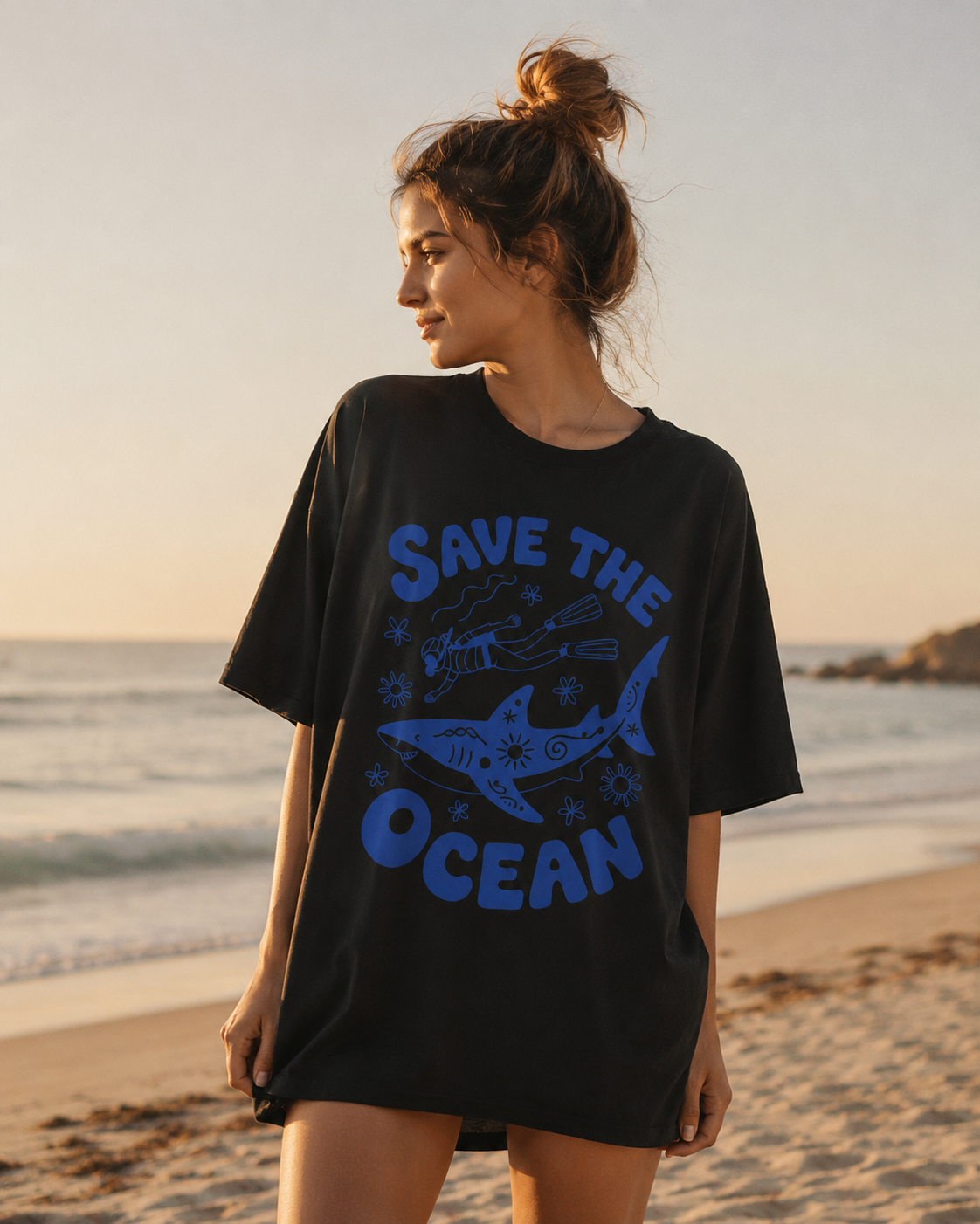 Woman wearing a 'Save the Ocean' t-shirt on a beach