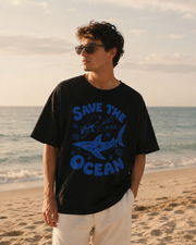 men wearing a 'Save the Ocean' t-shirt on a beach