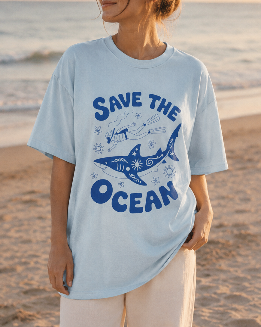 Person wearing a 'Save the Ocean' t-shirt on a beach