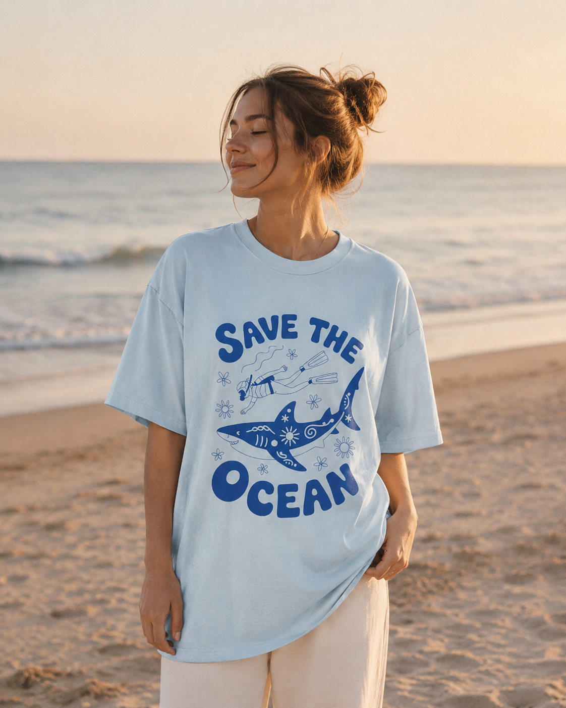 Person wearing a 'Save the Ocean' t-shirt on a beach