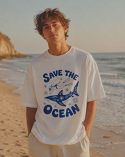 Person wearing a 'Save the Ocean' t-shirt on a beach
