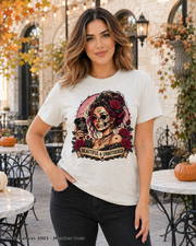 Female model wearing the Bella Canvas 3001 Heather Dust Beautiful & Unbothered gothic skull T-shirt