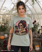 Female model wearing the Bella Canvas 3001 Sage Beautiful & Unbothered gothic skull T-shirt