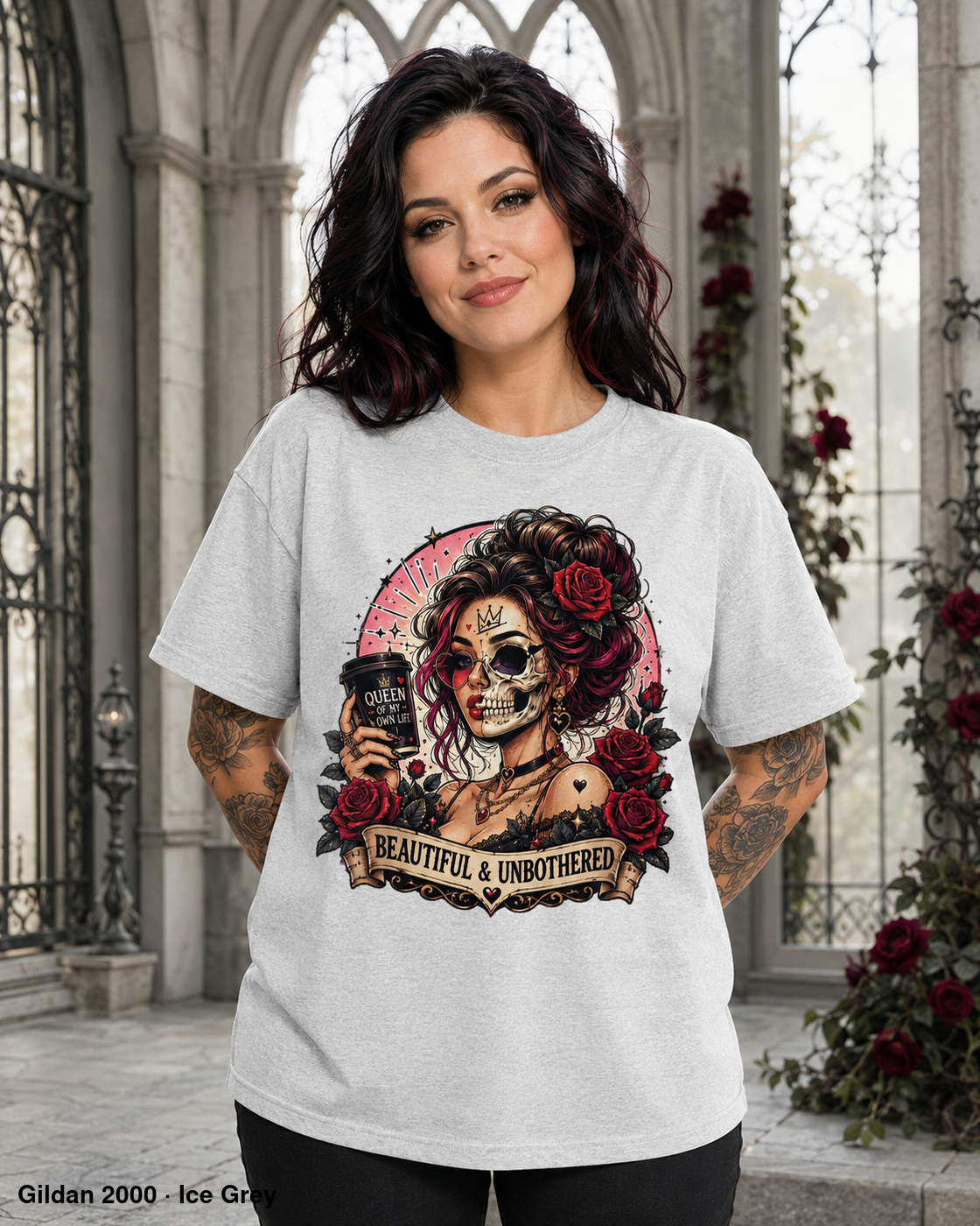 Female model wearing the Gildan 2000 Ice Grey Beautiful & Unbothered gothic skull T-shirt