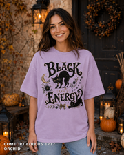 Black Cat Energy Vintage Halloween T-Shirt — Comfort Colors 1717 Orchid — female model