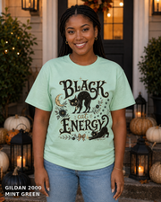 Black Cat Energy Vintage Halloween T-Shirt — Gildan 2000 Mint Green — female model