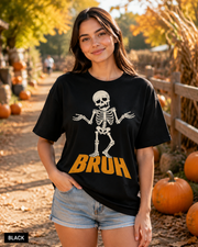 Female model wearing Black BRUH shrugging skeleton Halloween T-shirt