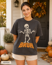 Female model wearing Pepper BRUH shrugging skeleton Halloween T-shirt