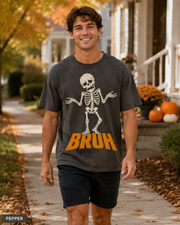 Male model wearing Pepper BRUH shrugging skeleton Halloween T-shirt
