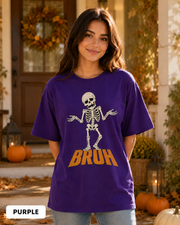 Female model wearing Purple BRUH shrugging skeleton Halloween T-shirt