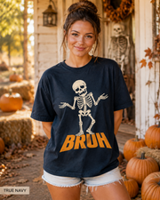 Female model wearing True Navy BRUH shrugging skeleton Halloween T-shirt