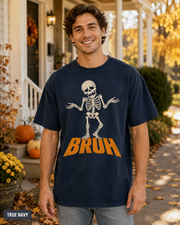 Male model wearing True Navy BRUH shrugging skeleton Halloween T-shirt