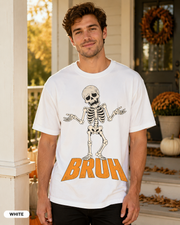 Male model wearing White BRUH shrugging skeleton Halloween T-shirt