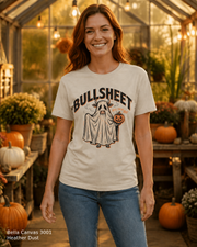 Female model wearing the Bella Canvas 3001 Heather Dust Bullsheet Ghost Cow Halloween T-shirt