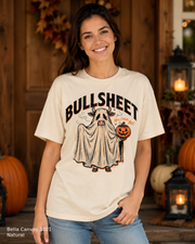 Female model wearing the Bella Canvas 3001 Natural Bullsheet Ghost Cow Halloween T-shirt