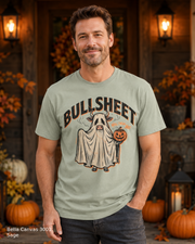 Male model wearing the Bella Canvas 3001 Sage Bullsheet Ghost Cow Halloween T-shirt