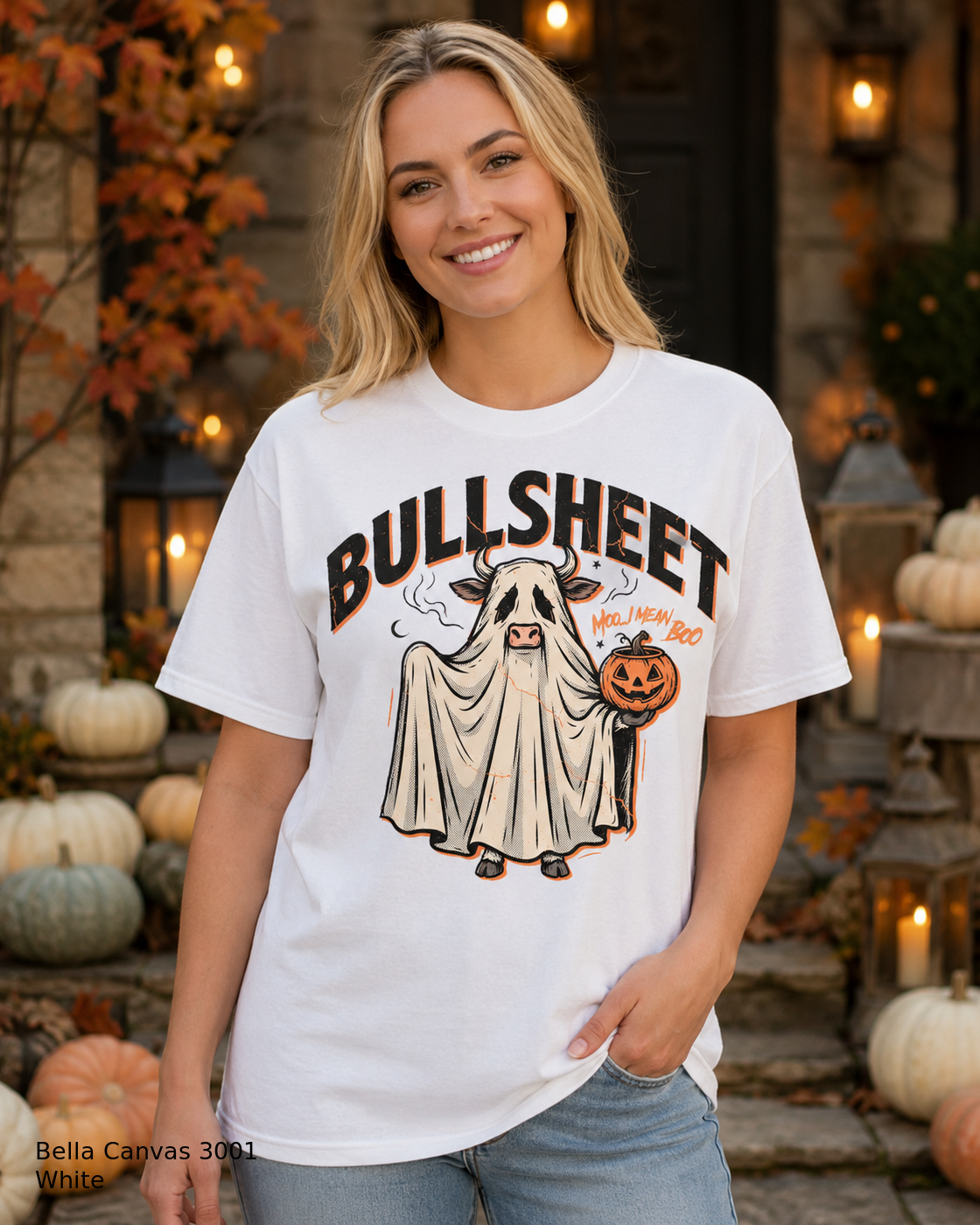 Female model wearing the Bella Canvas 3001 White Bullsheet Ghost Cow Halloween T-shirt