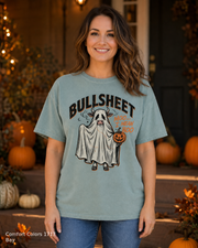 Female model wearing the Comfort Colors 1717 Bay Bullsheet Ghost Cow Halloween T-shirt