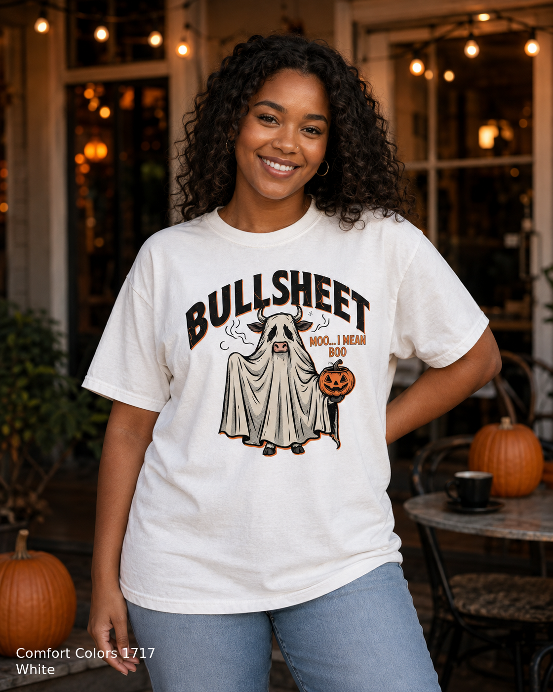 Female model wearing the Comfort Colors 1717 White Bullsheet Ghost Cow Halloween T-shirt
