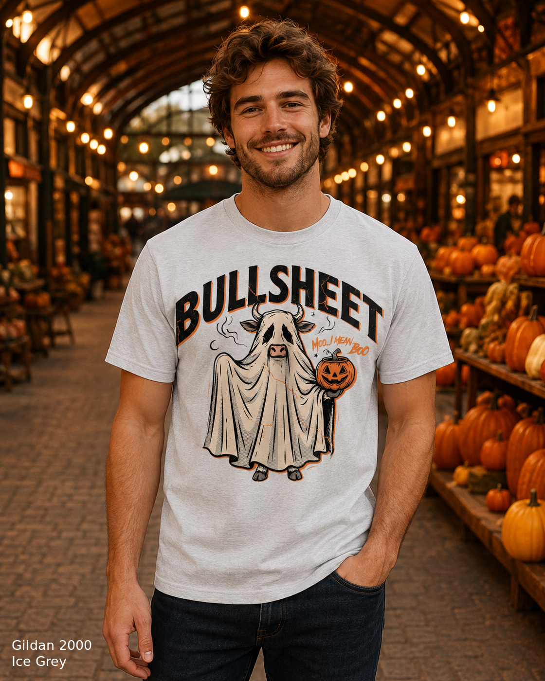 Male model wearing the Gildan 2000 Ice Grey Bullsheet Ghost Cow Halloween T-shirt