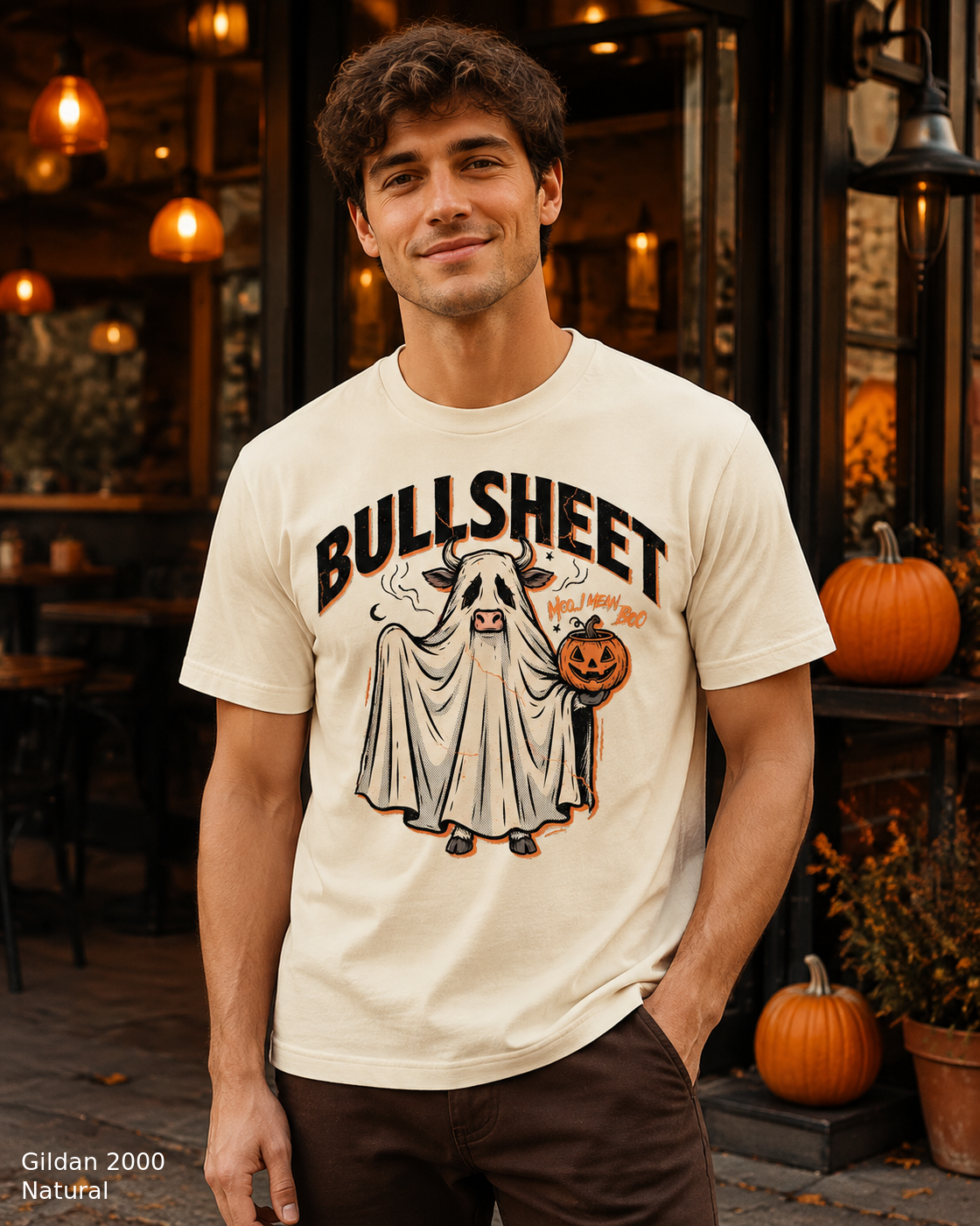 Male model wearing the Gildan 2000 Natural Bullsheet Ghost Cow Halloween T-shirt