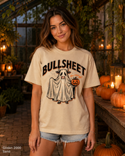 Female model wearing the Gildan 2000 Sand Bullsheet Ghost Cow Halloween T-shirt