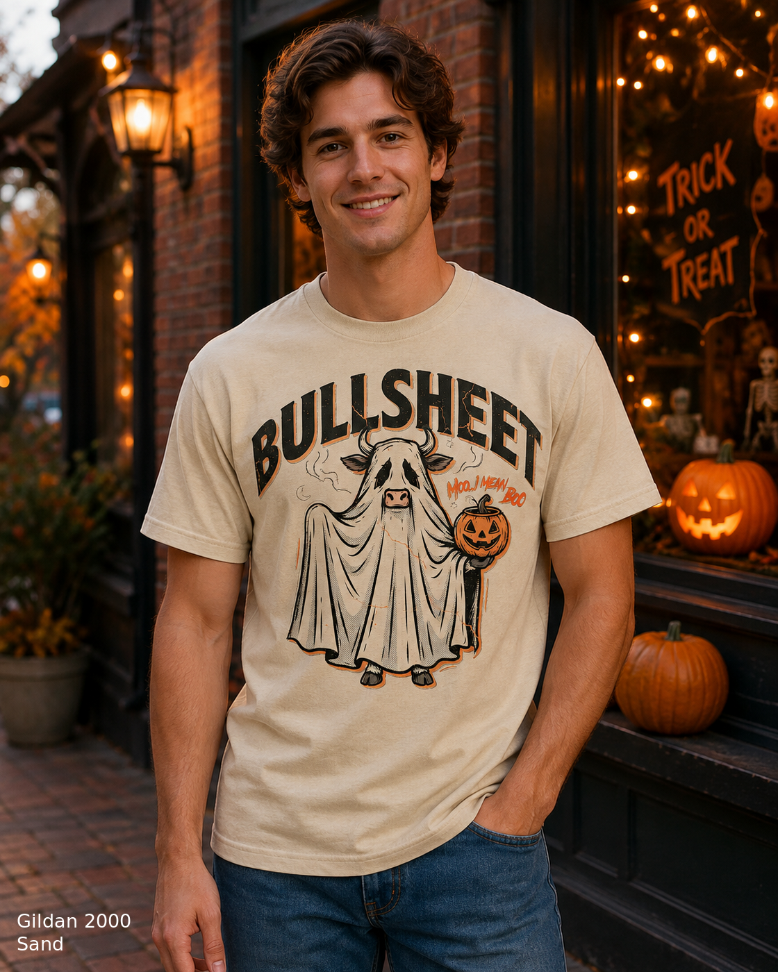 Male model wearing the Gildan 2000 Sand Bullsheet Ghost Cow Halloween T-shirt