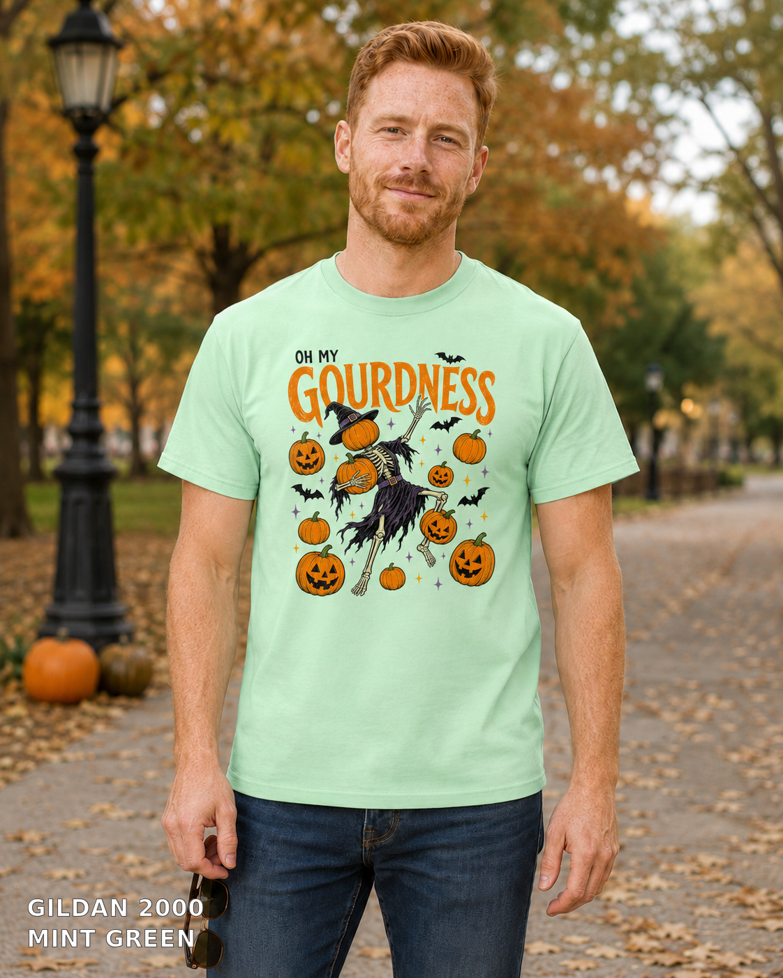 Male model wearing Oh My Gourdness Halloween skeleton T-shirt - Gildan 2000 - Mint Green
