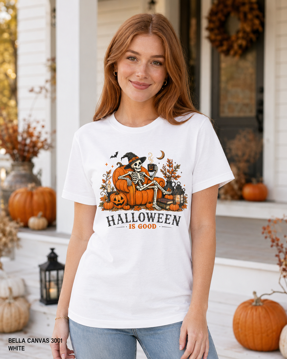 Female model wearing the Bella Canvas 3001 White Halloween Is Good skeleton pumpkin chair T-shirt