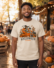Male model wearing the Gildan 2000 Sand Halloween Is Good skeleton pumpkin chair T-shirt