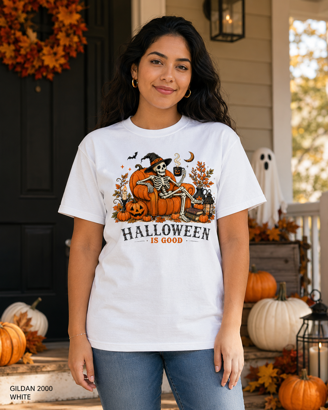 Female model wearing the Gildan 2000 White Halloween Is Good skeleton pumpkin chair T-shirt