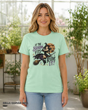 Female model wearing Bella Canvas 3001 Mint If the Broom Fits Ride It witch T-shirt with corrected Printify-matched print scale