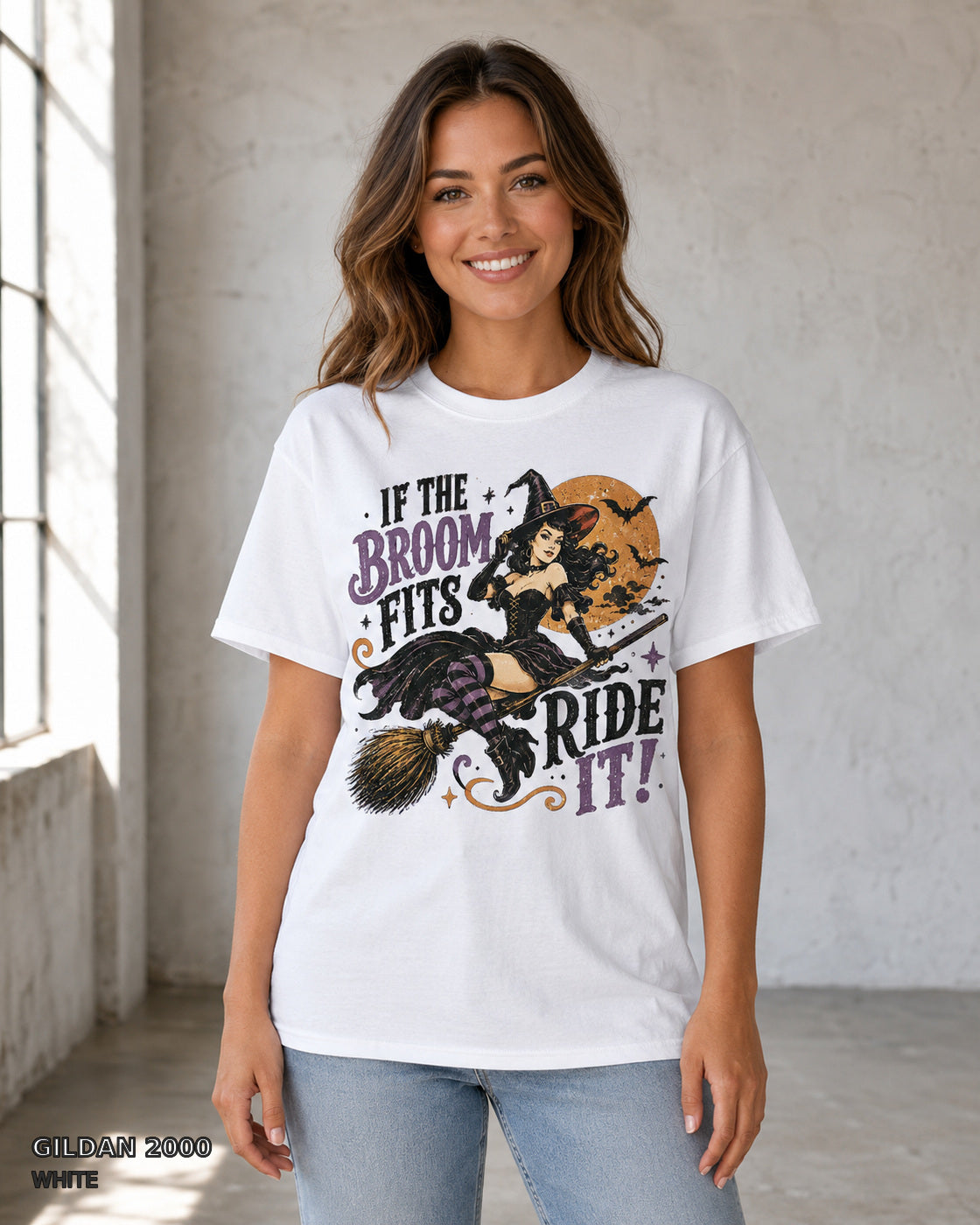 Female model wearing Gildan 2000 White If the Broom Fits Ride It witch T-shirt
