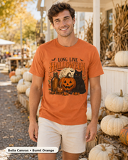Male model wearing Long Live Halloween black cat and pumpkin T-shirt in Bella Canvas Burnt Orange