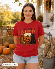 Female model wearing Long Live Halloween black cat and pumpkin T-shirt in Bella Canvas Red