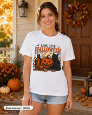 Female model wearing Long Live Halloween black cat and pumpkin T-shirt in Bella Canvas White