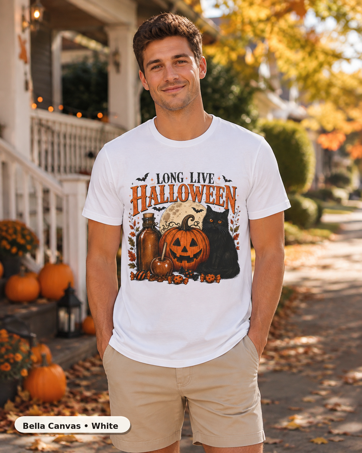 Male model wearing Long Live Halloween black cat and pumpkin T-shirt in Bella Canvas White