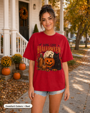 Female model wearing Long Live Halloween black cat and pumpkin T-shirt in Comfort Colors Red