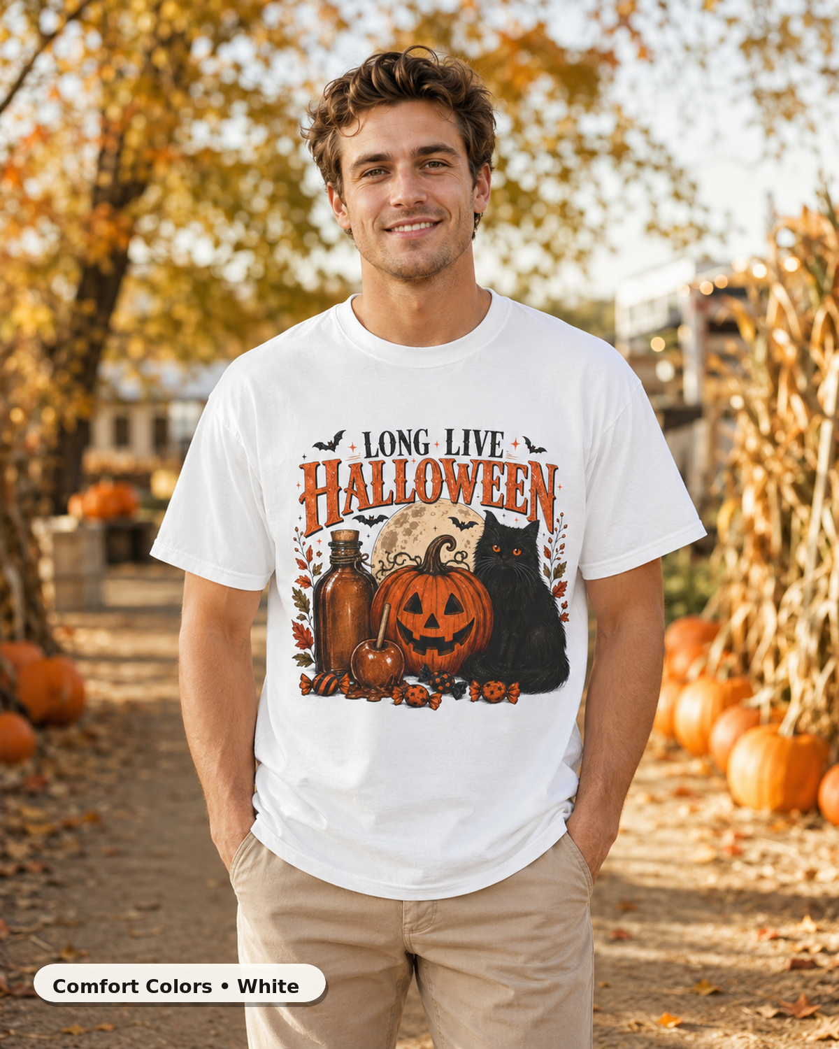 Male model wearing Long Live Halloween black cat and pumpkin T-shirt in Comfort Colors White