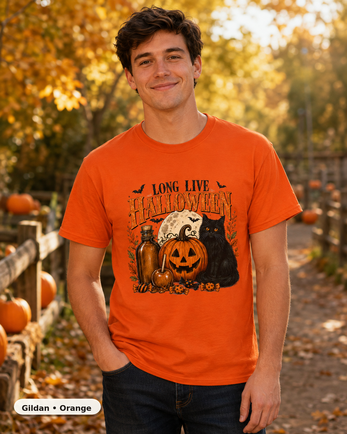 Male model wearing Long Live Halloween black cat and pumpkin T-shirt in Gildan Orange