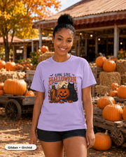 Female model wearing Long Live Halloween black cat and pumpkin T-shirt in Gildan Orchid