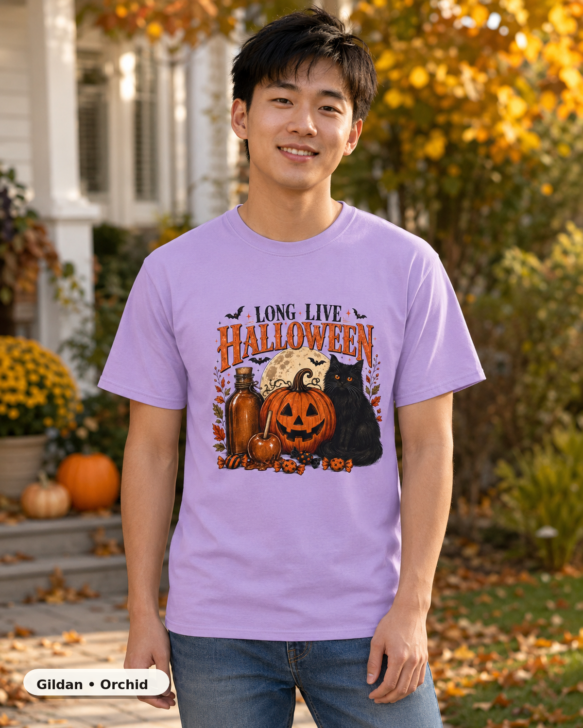 Male model wearing Long Live Halloween black cat and pumpkin T-shirt in Gildan Orchid