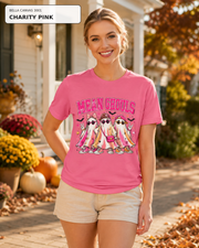 Female model wearing Mean Ghouls pink ghost Halloween T-shirt in Bella Canvas Charity Pink