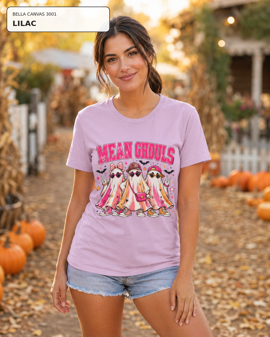 Female model wearing Mean Ghouls pink ghost Halloween T-shirt in Bella Canvas Lilac