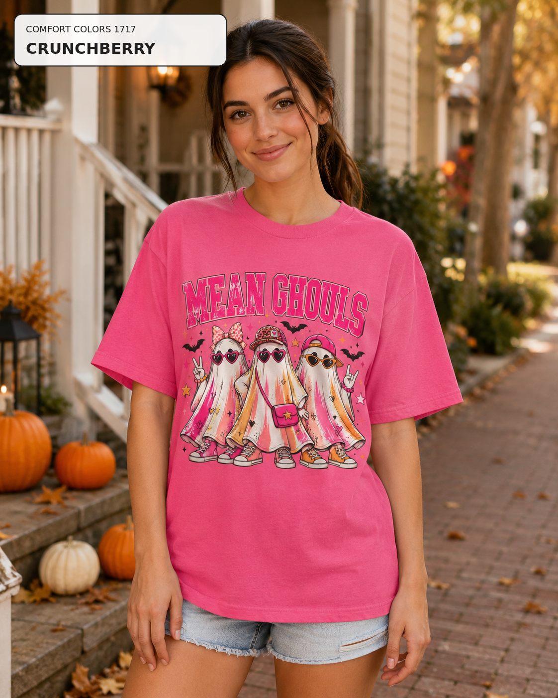 Female model wearing Mean Ghouls pink ghost Halloween T-shirt in Comfort Colors Crunchberry