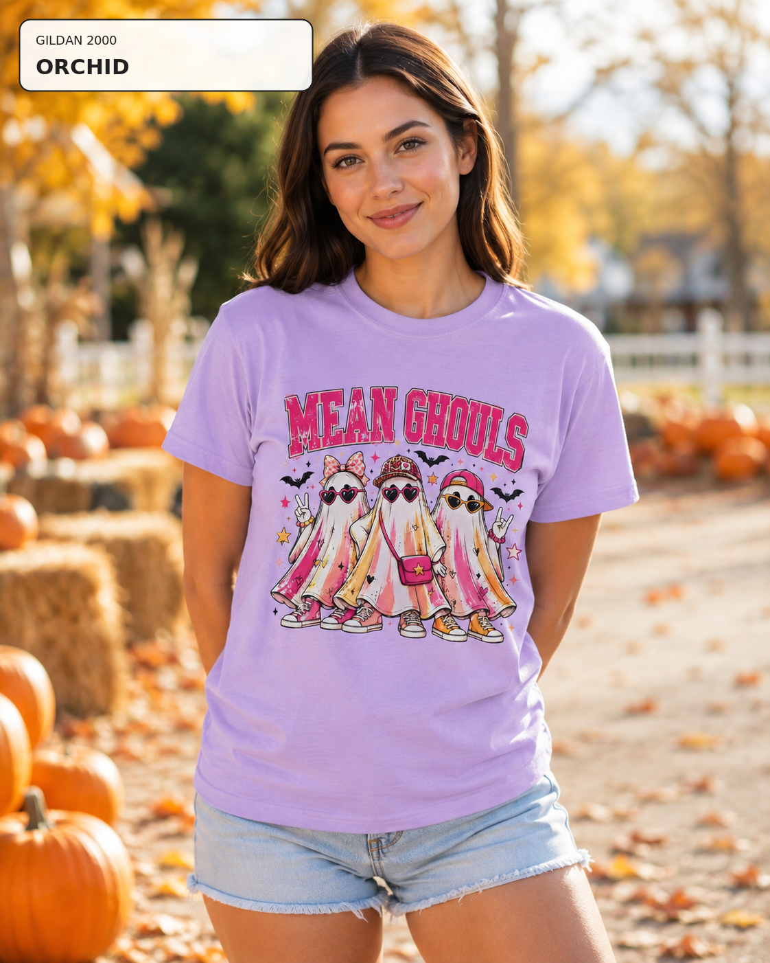 Female model wearing Mean Ghouls pink ghost Halloween T-shirt in Gildan Orchid